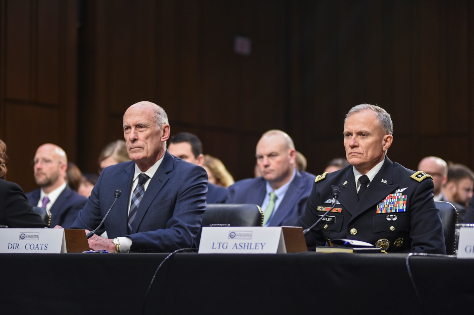 Director of National Intelligence Daniel Coats, left, and Director of the Defense Intelligence Agency Lt. Gen. Robert P. Ashley, Jr. listen to questions from lawmakers during the Worldwide Threat Assessment, Jan. 29, 2019, on Capitol Hill.