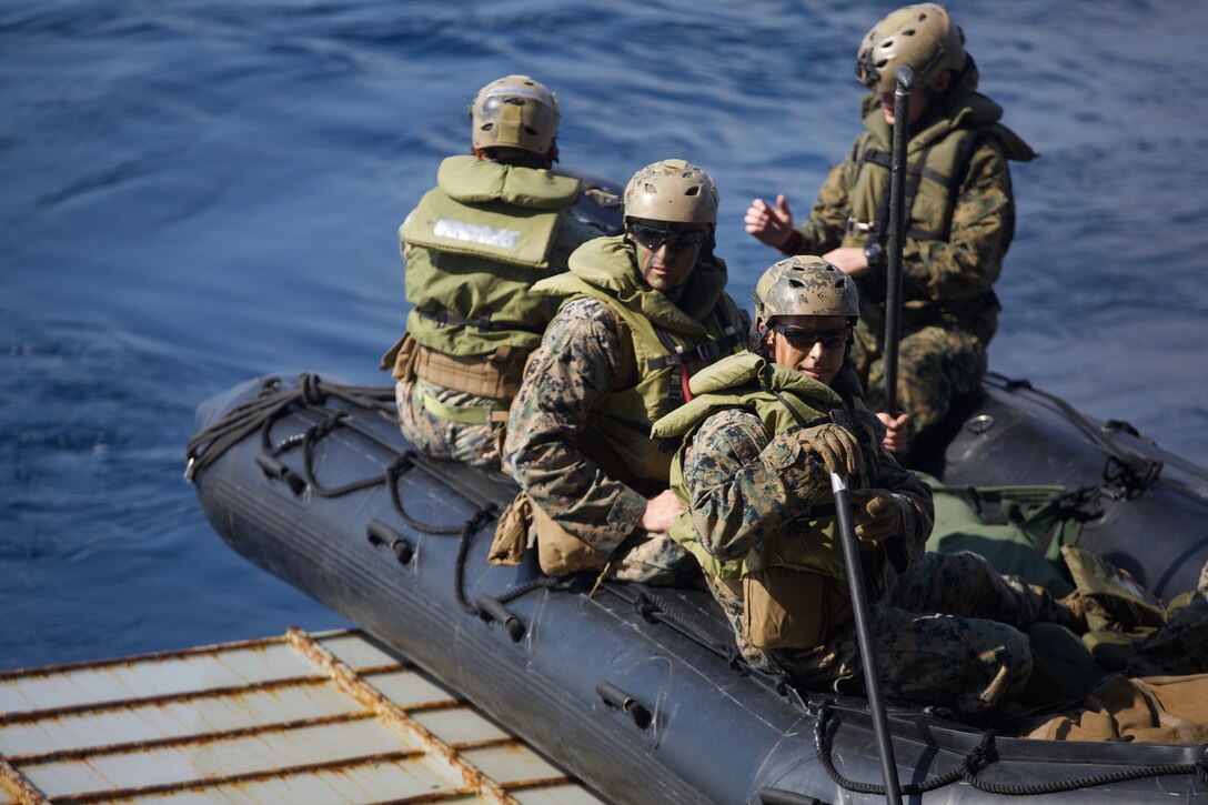 Marines with Alpha Company, Battalion Landing Team, 1st Battalion, 4th Marines, the “China Marines,” prepare to exit the dock landing ship USS Ashland (LSD 48) aboard a Combat Rubber Raiding Craft during a simulated boat raid, Philippine Sea, Jan. 25, 2019. Alpha Company Marines are the small boat raid specialists for BLT 1/4, the Ground Combat Element for the 31st Marine Expeditionary Unit. The 31st MEU, the Marine Corps’ only continuously forward-deployed MEU partnering with the Wasp Amphibious Ready Group, provides a flexible and lethal force ready to perform a wide range of military operations as the premier crisis response force in the Indo-Pacific region. (Official Marine Corps photo by Lance Cpl. Harrison C. Rakhshani/Released)