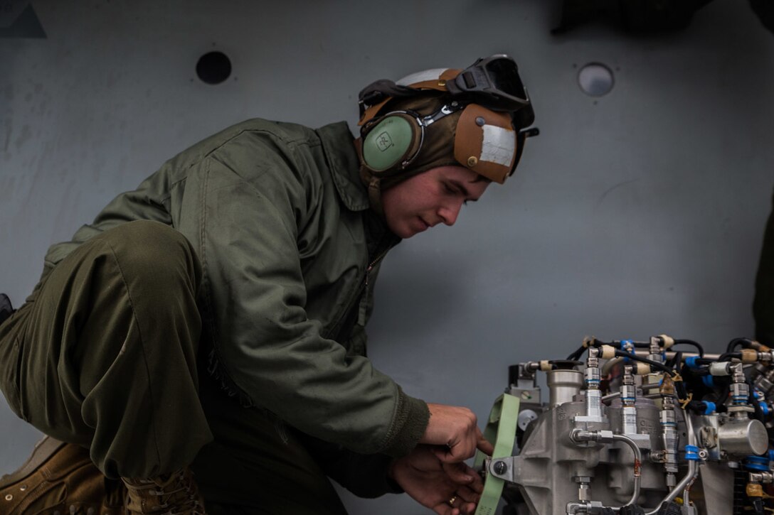 Sgt. Riley D. Schroer, a tiltrotor mechanic with Marine Medium Tiltrotor Squadron 262 (Reinforced), prepares an auxiliary power unit for installation onto an MV-22B Osprey tiltrotor aircraft atop the flight deck aboard the amphibious assault ship USS Wasp (LHD 1), Philippine Sea, Jan. 27, 2019. Schroer, a native of Liberty, Missouri, graduated from Liberty High School in May 2013 before enlisting in July the same year. VMM-262 (Rein.) is the Aviation Combat Element for the 31st Marine Expeditionary Unit. VMM-262 (Rein.) maintainers ensure the squadron’s aircraft are safe for flight during flight operations. The 31st MEU, the Marine Corps’ only continuously forward-deployed MEU partnering with the Wasp Amphibious Ready Group, provides a flexible and lethal force ready to perform a wide range of military operations as the premier crisis response force in the Indo-Pacific region. (U.S. Marine Corps photo by Lance Cpl. Kyle P. Bunyi/ Released)