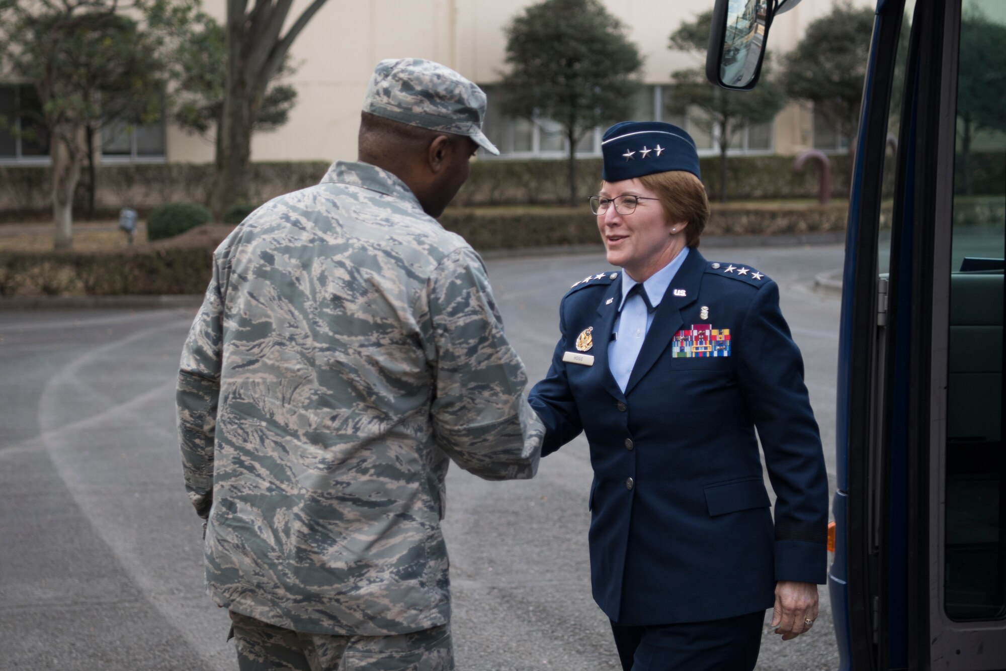 Lt. Gen. Dorothy Hogg, 23rd U.S. Air Force Surgeon General shakes hands with Col. Otis C. Jones, 374th Airlift Wing commander, Jan. 29, 2019, at Yokota Air Base, Japan.
