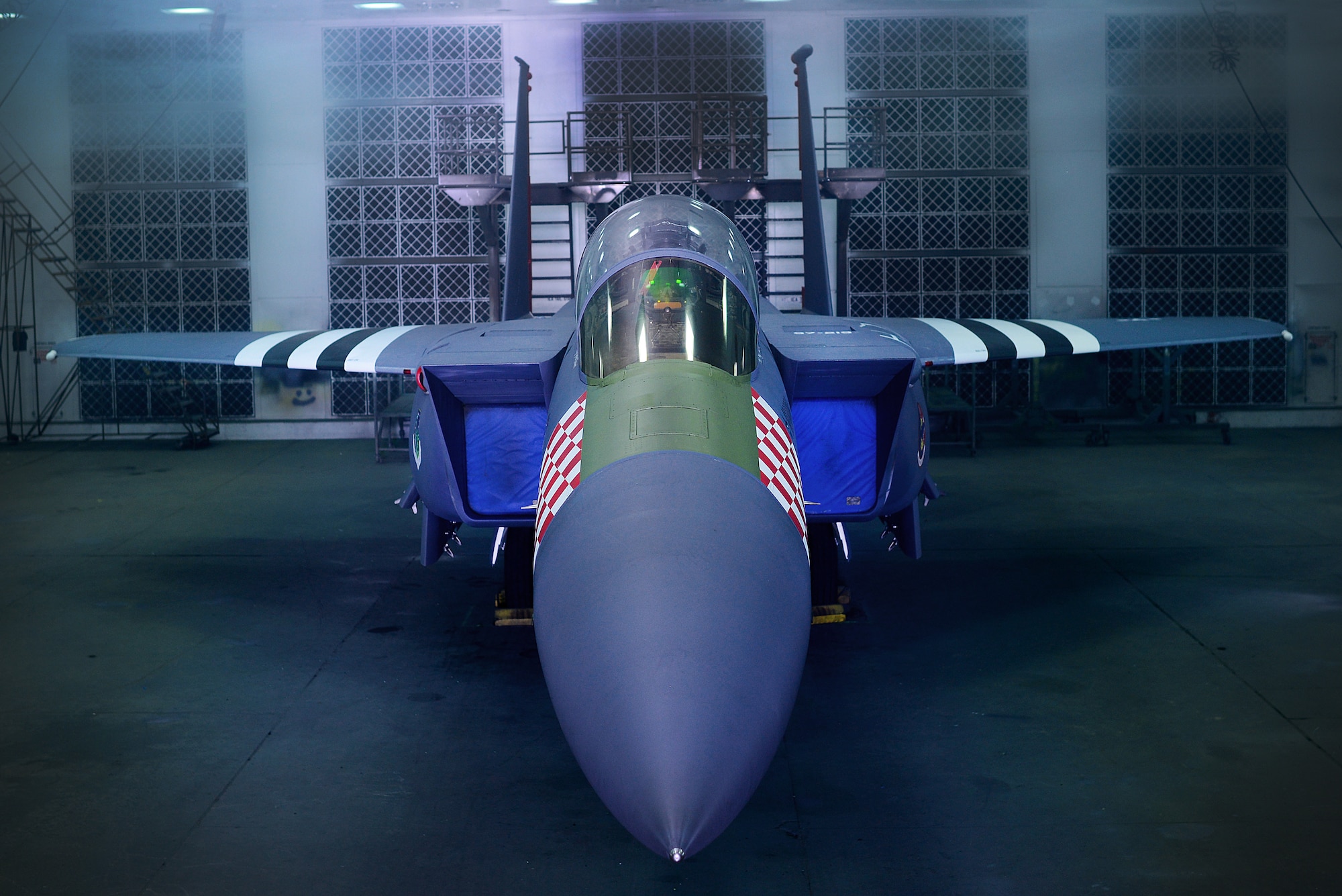 An F-15E Strike Eagle assigned to the 492nd Fighter Squadron is painted in the heritage colors of its World War II P-47 Thunderbolt predecessor at Royal Air Force Lakenheath, England Jan 30. The 48th Fighter Wing officially unveiled the aircraft publicly during a ceremony on Jan 31. (U.S. Air Force photo/Tech. Sgt. Matthew Plew)