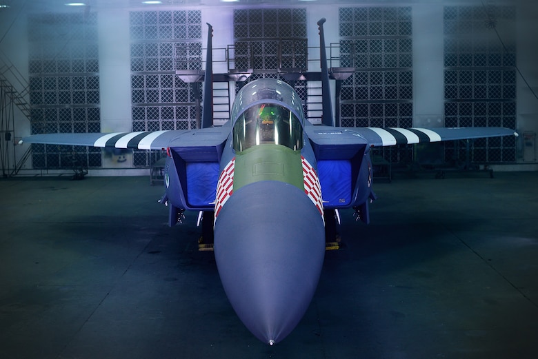 An F-15E Strike Eagle assigned to the 492nd Fighter Squadron is painted in the heritage colors of its World War II P-47 Thunderbolt predecessor at Royal Air Force Lakenheath, England Jan 30. The 48th Fighter Wing officially unveiled the aircraft publicly during a ceremony on Jan 31. (U.S. Air Force photo/Tech. Sgt. Matthew Plew)
