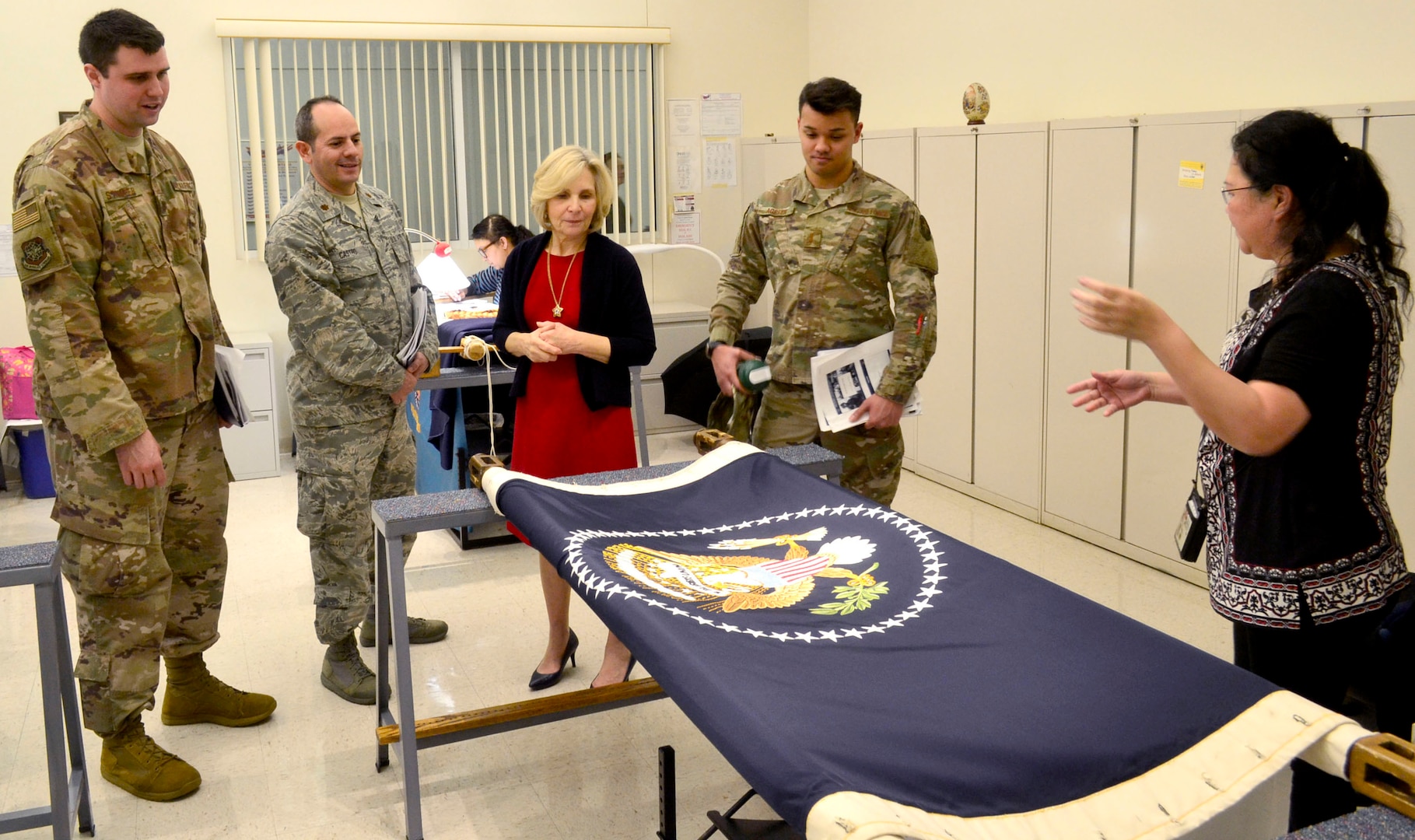 Visitors from the Logistics Officer Association’s Pudgy Chapter from Joint Base McGuire-Dix-Lakehurst view a nearly complete, hand embroidered presidential flag in DLA Troop Support’s flag room during a tour Jan. 24, 2019 in Philadelphia.