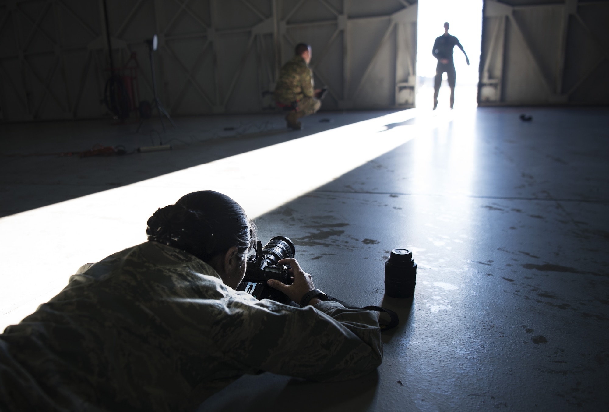 U.S. Air Force Senior Airman Kathryn Reaves, 20th Fighter Wing photojournalist, sets a photo illustration at Shaw Air Force Base, S.C., Jan. 25, 2019.