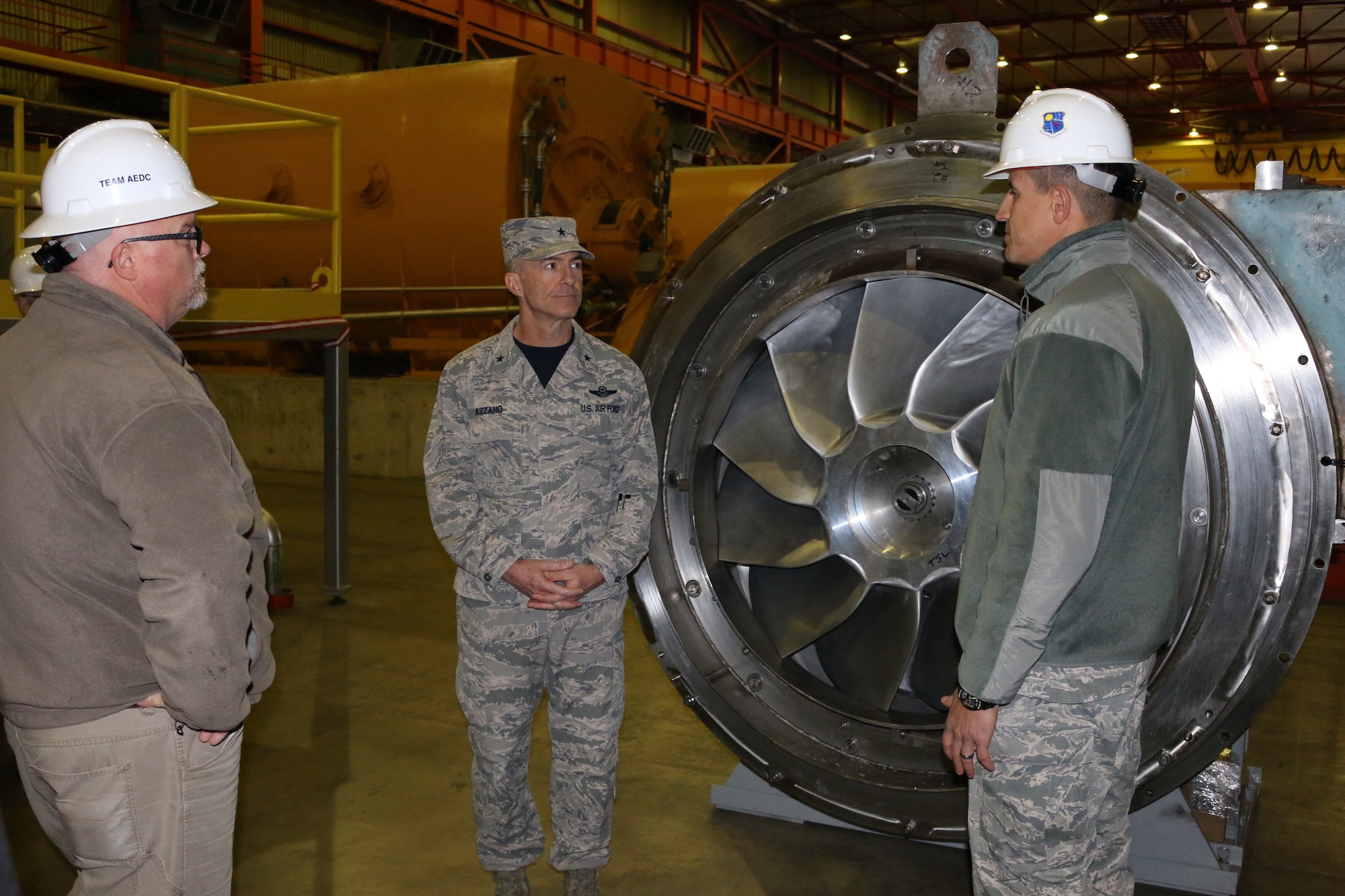Lt. Col. David Garay, director of the Aeropropulsion Combined Test Force at Arnold Air Force Base, right, discusses some of the equipment found within the Aeropropulsion Systems Test Facility with Brig. Gen. Christopher Azzano, commander of the Air Force Test Center, center. Pictured at left is ASTF Asset Manager Jimmy Steele. Azzano and other AFTC leadership visited Arnold Air Force Base in mid-November to take part in the 2018 AFTC Strategic Offsite, Azzano’s first offsite since assuming the role of AFTC commander in August. (U.S. Air Force photo by Brad Hicks)