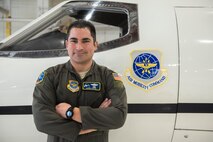 Lt. Col. James Chapa, 458th Airlift Squadron operations officer, poses in front of a legacy C-21 on Jan. 28, 2019 at Scott Air Force Base, Ill. As the operations officer, Chapa is responsible for ensuring coordinating the aircraft’s upgrades and training aircrew on the differences between the legacy C-21 and AUP upgraded C-21. One by one, C-21s are being sent to Wichita, Kansas, to receive new avionics and communications suites that will expand the aircraft’s reach, effectiveness, and capability.