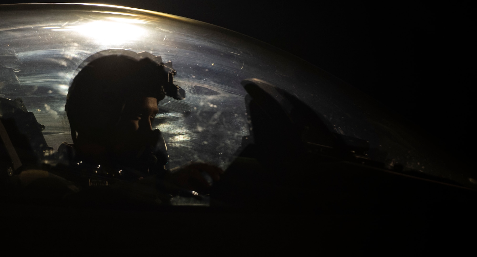 A U.S. Air Force F-16 pilot assigned to the 79th Fighter Squadron adjusts his gear prior to take-off during Exercise Red Flag 19-1 at Nellis Air Force Base, Nev., Jan. 30, 2019.