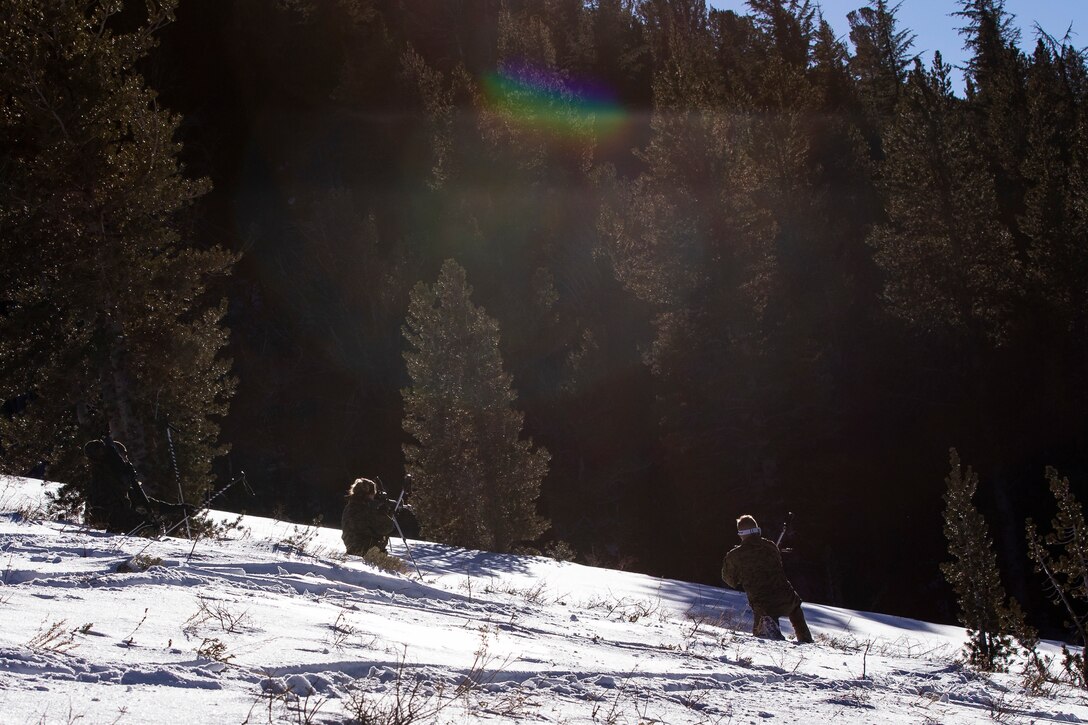 Marines in snowy field.