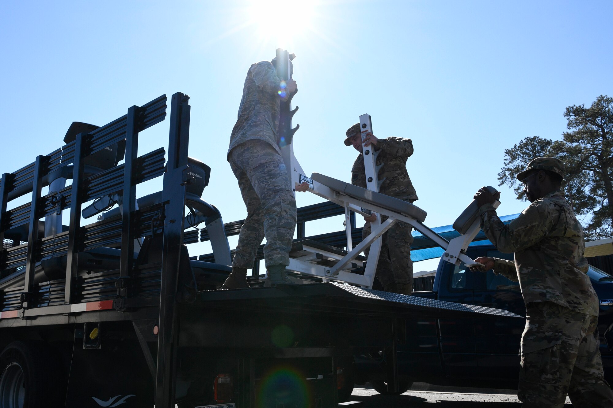 Members of 4th Fighter Wing load a weight bench for delivery to the 4th Operations Support Squadron Unit Physical Training Facility on Jan. 31, 2019, at Seymour Johnson Air Force Base, North Carolina.
