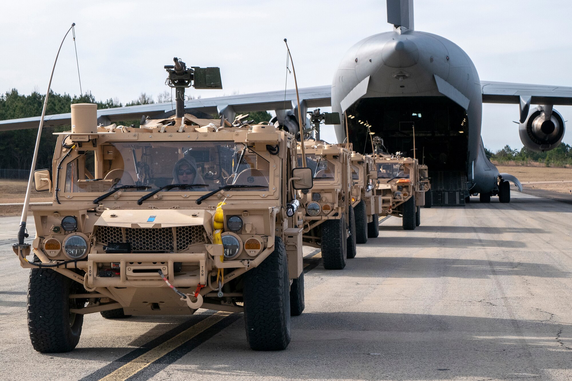 U.S. Army Soldiers and vehicles from the 3rd Special Forces Group prepare to board a Hawaii Air National Guard C-17 Globemaster III Jan. 21, 2019, at Camp Shelby Joint Forces Training Center near Hattiesburg, Miss. The 204th Airlift Squadron transported personnel and vehicles to the Gulfport Combat Readiness Training Center, Miss., during exercise Southern Strike. The annual training is a is a total force, multi-service exercise hosted by the Mississippi Air National Guard’s Combat Readiness Training Center in Gulfport,