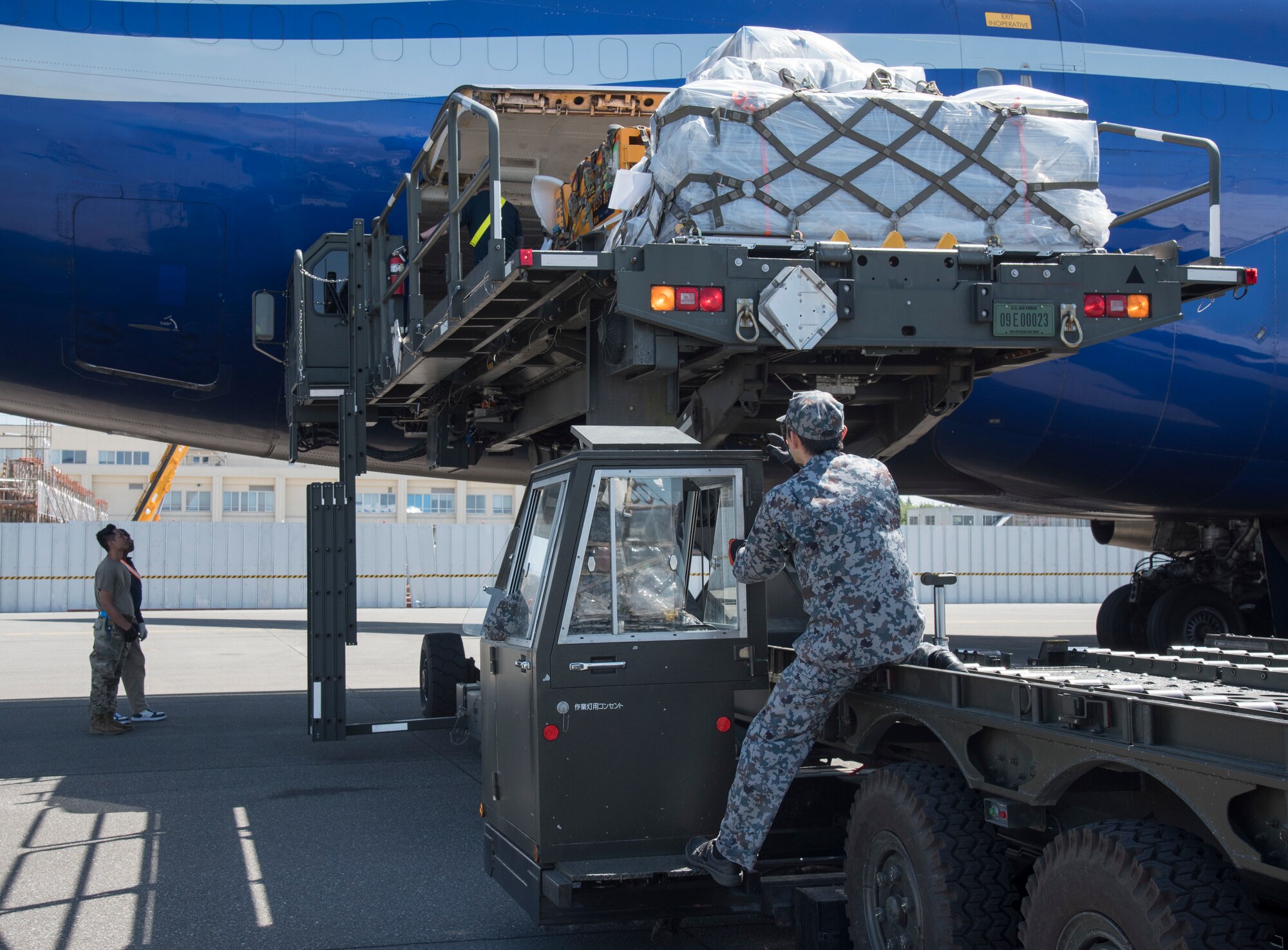 U.S. Air Force and Japan Air Self Defense Force personnel load supplies headed for RED FLAG-Alaska 19-2 into a Boeing 747 at Misawa Air Base, Japan, May 25, 2019. The bilateral coordination of cargo included 35th Logistics Readiness Squadron, PACAF Air Mobility Command, JASDF and the 35th munitions flight. (U.S. Air Force photo by Branden Yamada)