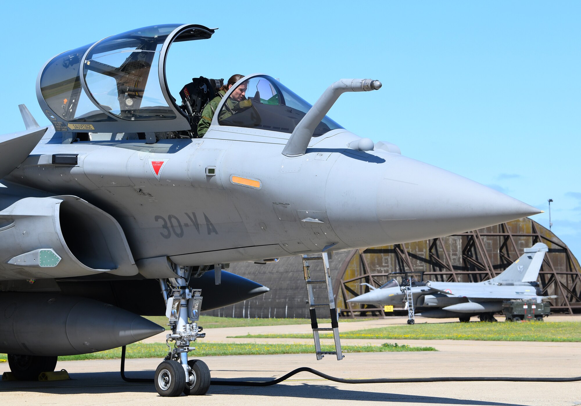 A French Air Force pilot prepares a Rafale for takeoff during exercise Point Blank 19-2 at Royal Air Force Lakenheath, England, June 17, 2019. During this trilateral exercise, participating air forces are enhancing professional relationships and improving overall coordination with allies and partner militaries during times of crisis. (U.S. Air Force photo by Staff Sgt. Alex Fox Echols III/Released)