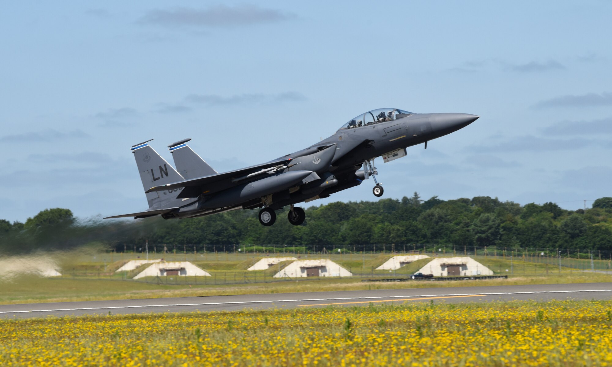 A 492nd Fighter Squadron F-15E Strike Eagle takes off during exercise Point Blank 19-2 at Royal Air Force Lakenheath, England, June 27, 2019. This trilateral exercise provides a low-cost initiative designed to increase the tactical proficiency of participating air forces. (U.S. Air Force photo by Airman 1st Class Rhonda Smith)