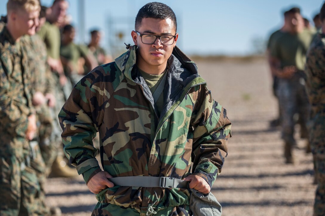 U.S. Marine Corps Lance Cpl. Raul Camacho, a Chemical, Biological, Radiological, and Nuclear Defense (CBRN) Specialist with Marine Air Control Squadron (MACS) 1, poses for a photo during CBRN training at the Marine Corps Air Station (MCAS) Yuma, Ariz. Gas Chamber, June 27, 2019. The gas chamber is a controlled environment in which a non-lethal gas is released, allowing Marines to test their issued gas masks and become familiar with the effects of gas. (U.S. Marine Corps photo by Cpl. Sabrina Candiaflores)
