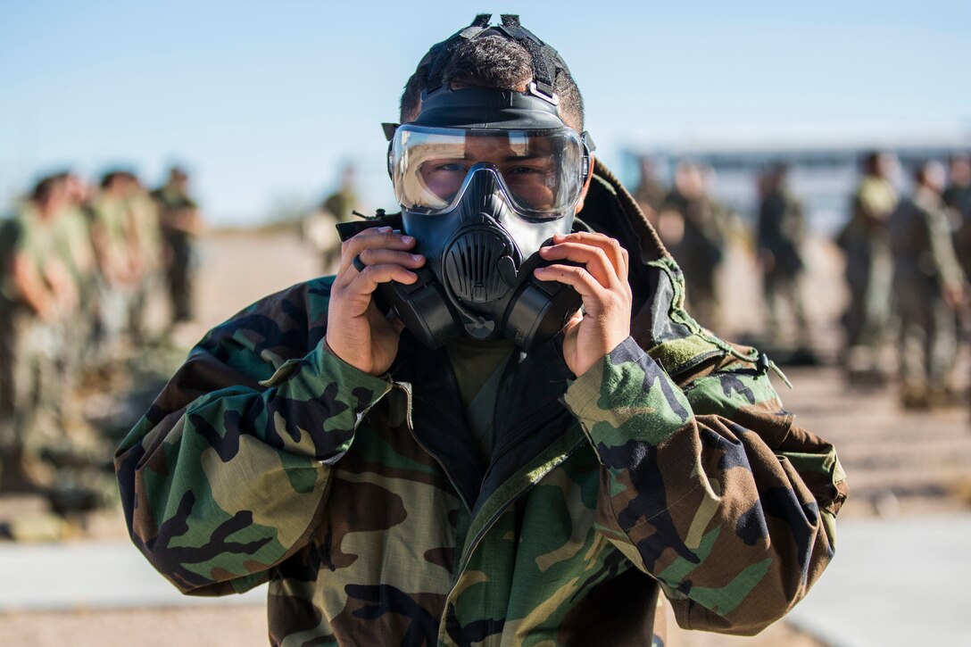 U.S. Marine Corps Lance Cpl. Raul Camacho, a Chemical, Biological, Radiological, and Nuclear Defense (CBRN) Specialist with Marine Air Control Squadron (MACS) 1, poses for a photo during CBRN training at the Marine Corps Air Station (MCAS) Yuma, Ariz. Gas Chamber, June 27, 2019. The gas chamber is a controlled environment in which a non-lethal gas is released. This trains Marines to have confidence in their gear and become familiar with the effects of gas. (U.S. Marine Corps photo by Cpl. Sabrina Candiaflores)