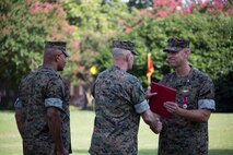 U.S. Marine Corps Col. Thomas H. Campbell III, right, the outgoing commanding officer of Headquarters and Service Battalion, U.S. Marine Corps Forces Command, is awarded the Legion of Merit during a change of command ceremony at Naval Support Activity Hampton Roads, Virginia, June 27, 2019.