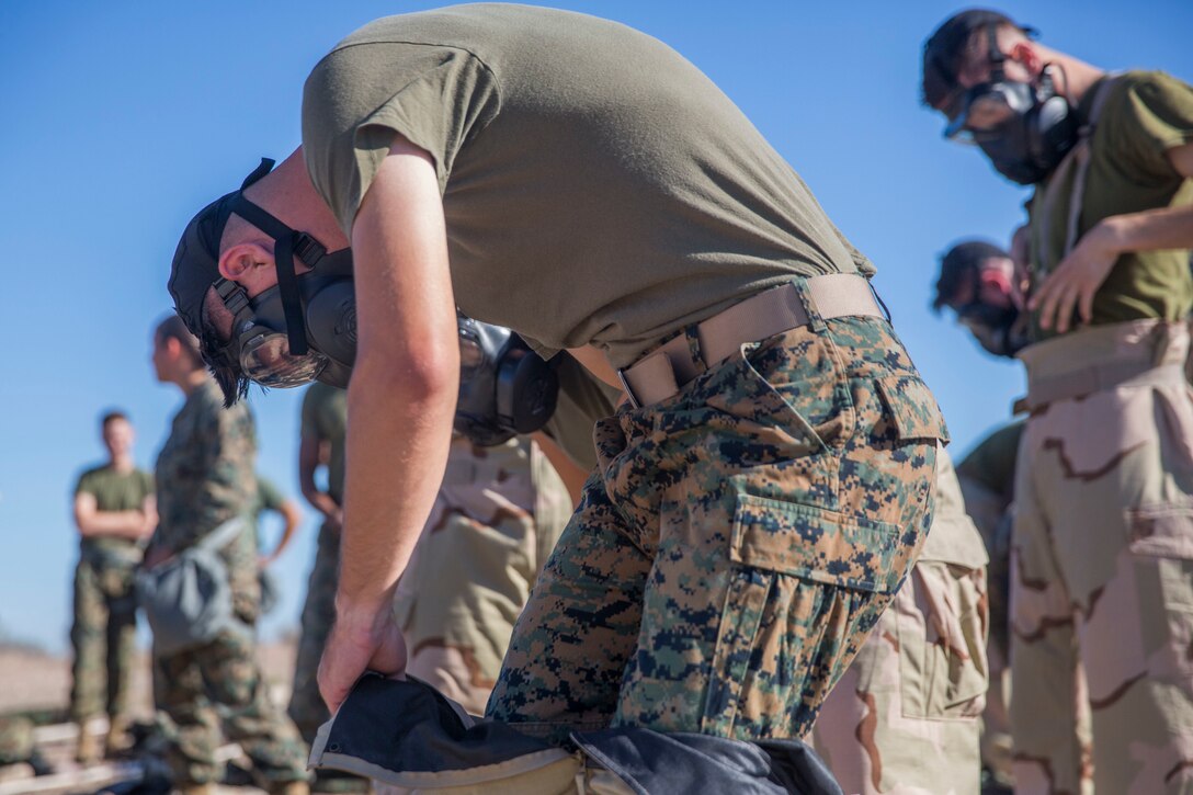 U.S. Marines stationed at Marine Corps Air Station (MCAS) Yuma conduct their Chemical, Biological, Radiological and Nuclear Defense (CBRN) training at the MCAS Yuma, Ariz. Gas Chamber, June 27, 2019. The gas chamber is a controlled environment in which a non-lethal gas is released, allowing Marines to test their issued gas masks and become familiar with the effects of gas. (U.S. Marine Corps photo by Cpl. Sabrina Candiaflores)