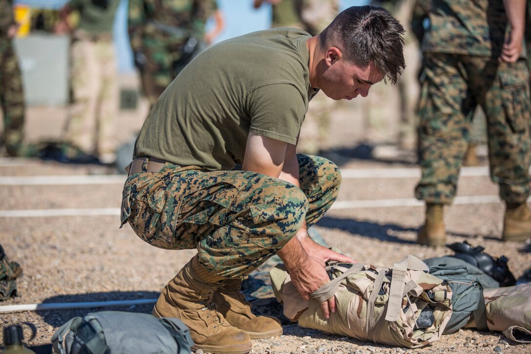 U.S. Marines stationed at Marine Corps Air Station (MCAS) Yuma conduct their Chemical, Biological, Radiological and Nuclear Defense (CBRN) training at the MCAS Yuma, Ariz. Gas Chamber, June 27, 2019. The gas chamber is a controlled environment in which a non-lethal gas is released, allowing Marines to test their issued gas masks and become familiar with the effects of gas. (U.S. Marine Corps photo by Cpl. Sabrina Candiaflores)