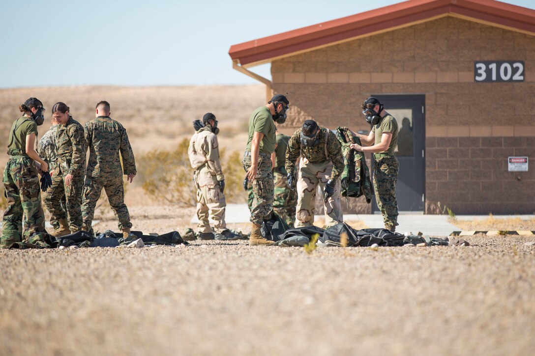 U.S. Marines stationed at Marine Corps Air Station (MCAS) Yuma conduct their Chemical, Biological, Radiological and Nuclear Defense (CBRN) training at the MCAS Yuma, Ariz. Gas Chamber, June 27, 2019. The gas chamber is a controlled environment in which a non-lethal gas is released, allowing Marines to test their issued gas masks and become familiar with the effects of gas. (U.S. Marine Corps photo by Cpl. Sabrina Candiaflores)