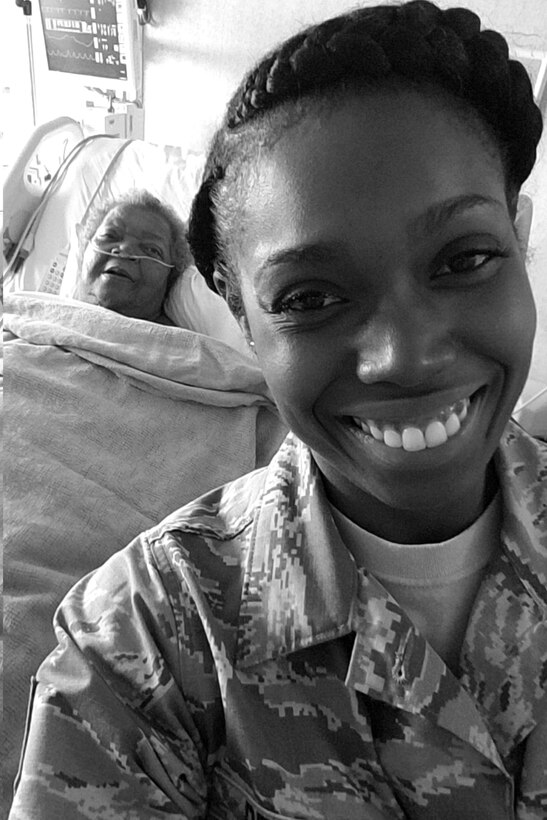 U.S. Air Force Tech. Sgt. Neosha Benson, 307th Force Support Squadron unit training manager, poses for a photo with her great grandmother while volunteering at a nursing home in Plain Dealing, Louisiana (date).  Benson’s leadership nominated her for the Bossier Chamber of Commerce Patriot Award as a result of her work ethic and extensive volunteer work. (courtesy photo)