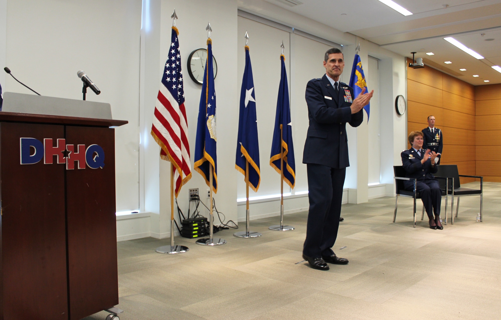 Image of Brig. Gen. Mark Koeniger standing by a podium.