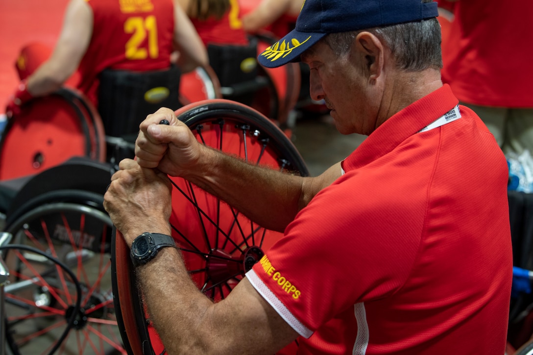 A U.S. Marine Corps team staff member checks the equipment functionality at the DoD Warrior Games wheelchair rugby competition in Tampa, Florida, June 27, 2019. The DoD Warrior Games is an adaptive sports competition for wounded, ill and injured service members and veterans. The 2019 Warrior Games consist of 13 Paralympic-style sports, and more than 300 athletes representing the U.S. Marine Corps, Army, Navy, Air Force, Special Operations Command, and five international teams.