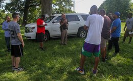 Capt. Marvin Rhinehart , an officer with Hardin County Sheriff's Office, briefs Soldiers and their families about traffic safety and the law enforcement during the 1st Theater Sustainment Command Safety Stand Down Day at Fort Knox, Ky., June 27, 2019.