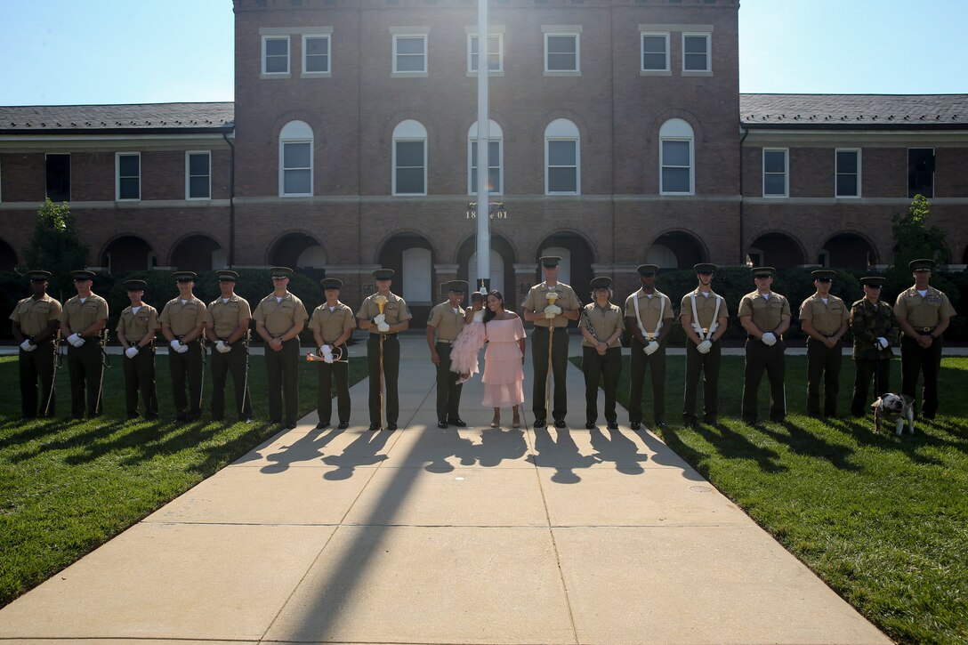 Marines with Marine Barracks Washington pose for a photo with the Analia Naylin Pages and her parents after parade practice at Marine Barracks Washington, D.C., June 28, 2019. Analia Naylin Pages, the daughter of Master Sgt. Edward Pages III and retired Gunnery Sgt. Ana Liz Perez has B-Cell Acute Lymphoblastic Leukemia and served as our guest of honor for the parade practice.