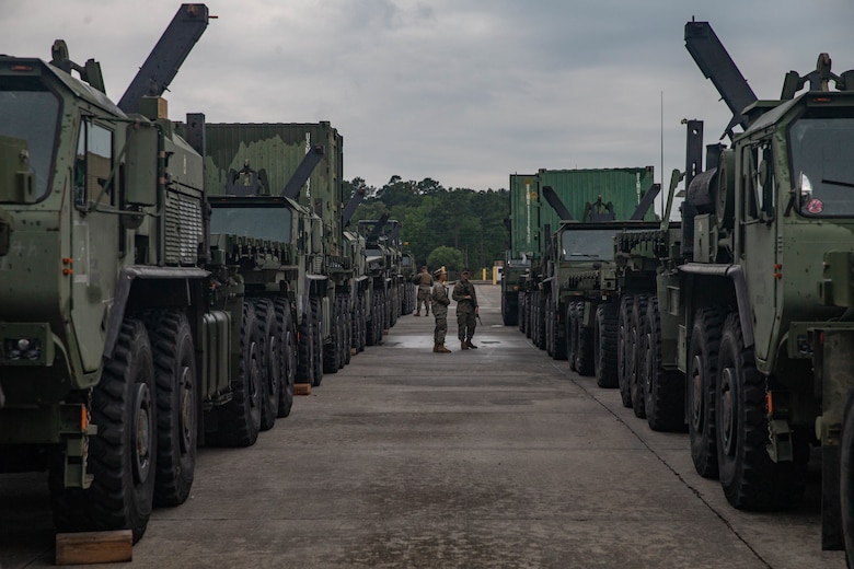 U.S. Marines with 2nd Transportation Support Battalion, Combat Logistics Regiment 2, 2nd Marine Logistics Group, clean the inside of vehicles while staged to be loaded on to the USNS Watkins during exercise Resolute Sun at Joint Base Charleston, South Carolina, June 11, 2019. Marines participated in the exercise to increase major combat operational readiness in amphibious and prepositioning operations while conducting joint training with the U.S. Army during a joint logistics over the shore scenario.