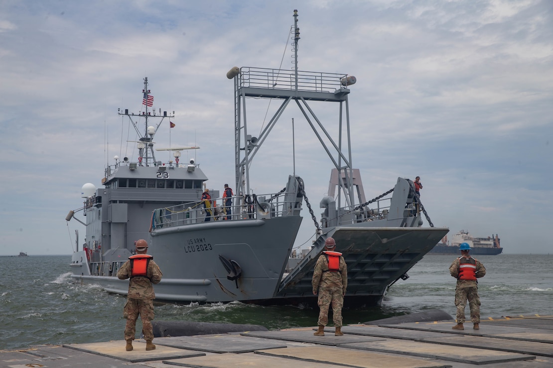 U.S. Army Soldiers with 11th Transportation Battalion, 7th Transportation Regiment prepare for a landing craft, utility to dock on a trident pier during exercise Resolute Sun at Fort Story, Virginia, June 18, 2019. U.S. Marines participated in the exercise to increase combat operational readiness in amphibious and prepositioning operations while conducting joint training with the U.S. Army during a joint logistics over the shore scenario.