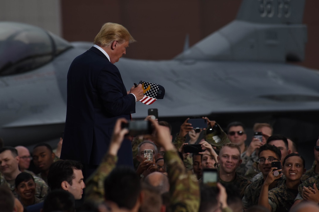 President signs autographs