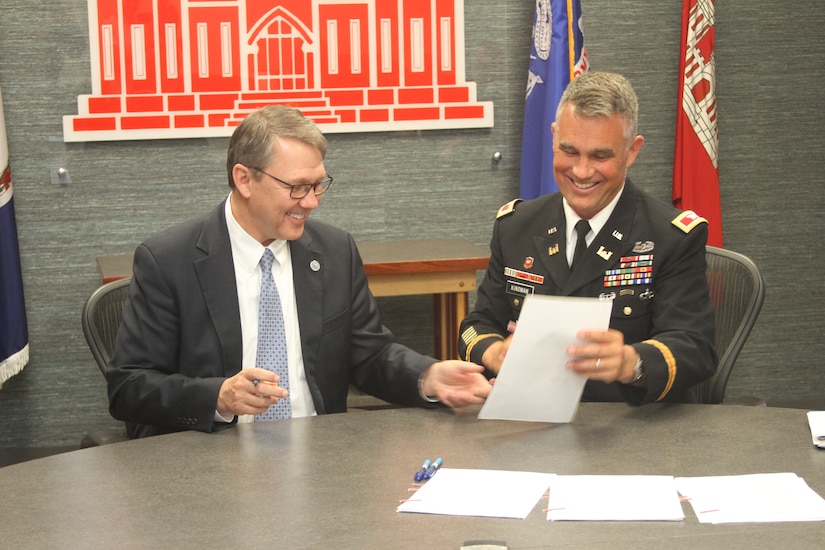 Norfolk City Manager Doug Smith and Col. Patrick Kinsman, commander of Norfolk District, U.S. Army Corps of Engineers, sign the Norfolk Coastal Storm Risk Management design agreement at the Waterfield Building on Fort Norfolk, Virginia, June 28, 2019.
