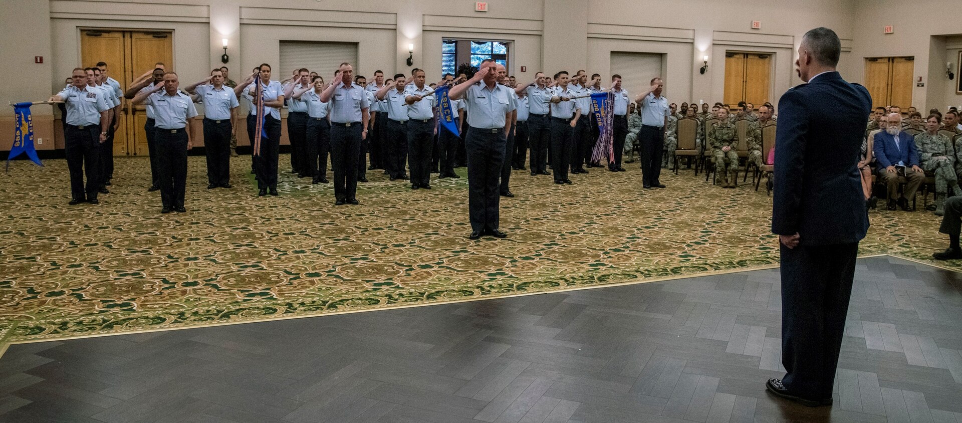 Col. Eric DeLange, 688th Cyberspace Wing commander, renders a “final salute” to 688th CW Airmen during the wing’s change of command ceremony at Joint Base San Antonio-Lackland June 25. Col. Steven Anderson took command of the 688th CW during the ceremony.