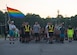 U.S. Army Spc. Jimmy Scott-Tingle, Medical Department Activity patient administration specialist, holds a rainbow flag during a Pride Observance Month 5K run at Joint Base Langley-Eustis, Virginia, June 21, 2019.