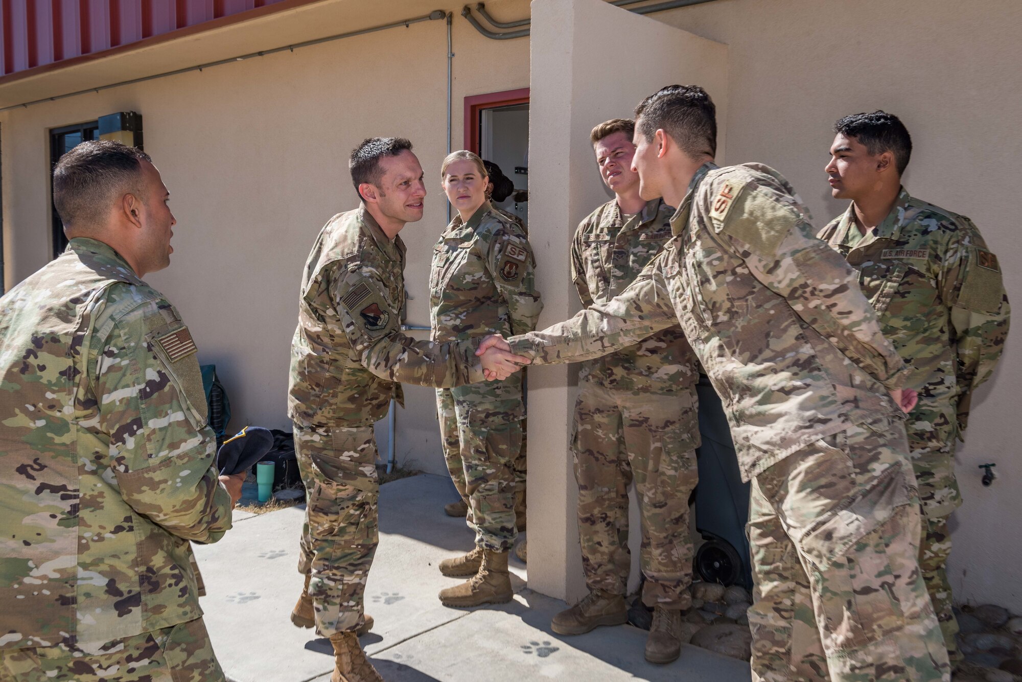 Chief Master Sgt. Ian Eishen, 412th Test Wing Command Chief, visits the 412th Security Forces' working dog kennels at Edwards Air Force Base, California, June 27. (U.S. Air Force photo by Matthew Williams)