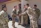 Chief Master Sgt. Ian Eishen, 412th Test Wing Command Chief, visits the 412th Security Forces' working dog kennels at Edwards Air Force Base, California, June 27. (U.S. Air Force photo by Matthew Williams)