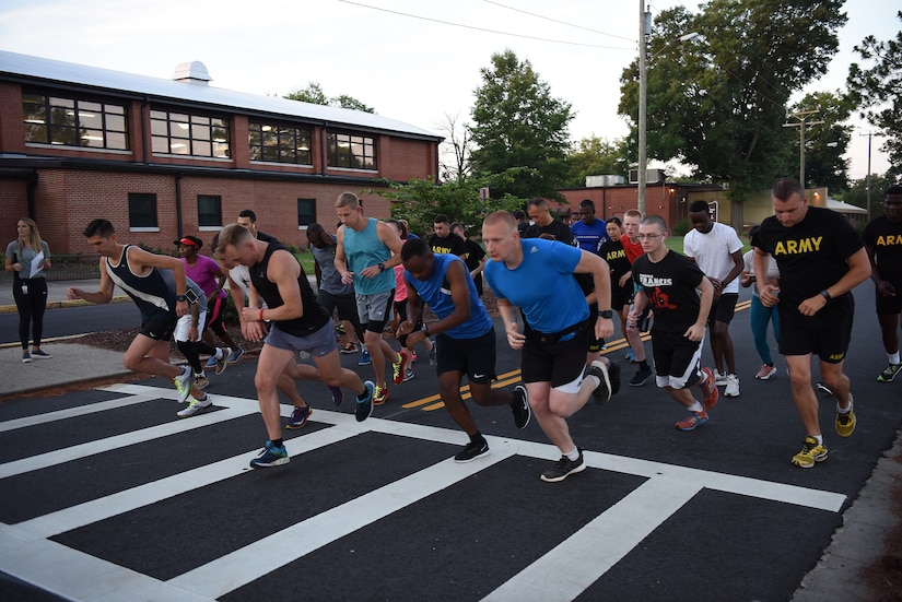 Participants for the Army Ten-Miler try-outs take off at the start line at Joint Base Langley-Eustis, Virginia, June 28, 2019.Eight service members were selected to train and compete in the 2019 Army Ten-Miler. (U.S. Air Force photo by Senior Airman Delaney Gonzales)