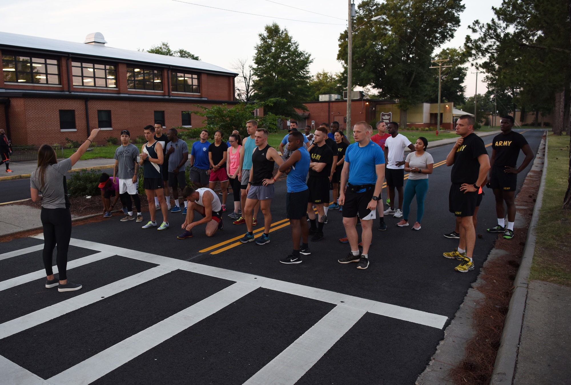 Kacey Gibson, a master resilience trainer-performance expert with the Fort Eustis Ready and Resilient Performance Center speaks to the participants of the Army Ten-Miler try-outs at Joint Base Langley-Eustis, Virginia, June 28, 2019. More than 25 service members came out in an attempt to represent JBLE in this year’s Army Ten-Miler competition. (U.S. Air Force photo by Senior Airman Delaney Gonzales)