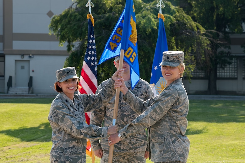 Col. Patricia Fowler, 436th Medical Group commander, hands Lt Col. Lisa Palmer, the guidon of the newly designated 436th Health Care Operations Squadron during a redesignation ceremony June 28, 2019, at the 436th MDG on Dover Air Force Base, Del. Activated in 1992, the 436th MDOS was redesignated as the 436th HCOS, in accordance with the 436th MDG’s reorganization as directed by the Secretary of the Air Force’s 2019 policy. (U.S. Air Force photo by Roland Balik)