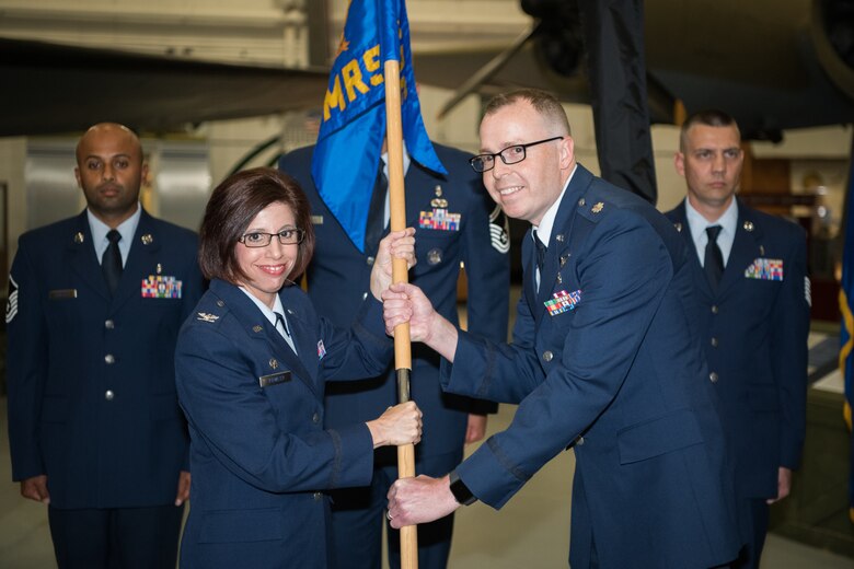 Lt. Col. Andrew Rees, 436th Operational Medical Readiness Squadron commander, accepts the squadron guidon from Col. Patricia Fowler, 436th Medical Group commander, during a change-of-command and redesignation ceremony June 28, 2019, at the Air Mobility Command Museum on Dover Air Force Base, Del. During the ceremony, the 436th Aerospace Medicine Squadron was redesignated as the 436th Operational Medical Readiness Squadron. (U.S. Air Force Photo by Mauricio Campino)