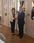Elaine Chapman, Defense Logistics Agency Logistics Operations employee and new chair of Allied Committee 135’s Main Group, presents a plaque to the previous chair, Thierry Vanden Dries of Belgium after he turned over the chair to her in Reims, France, at the Main Group.