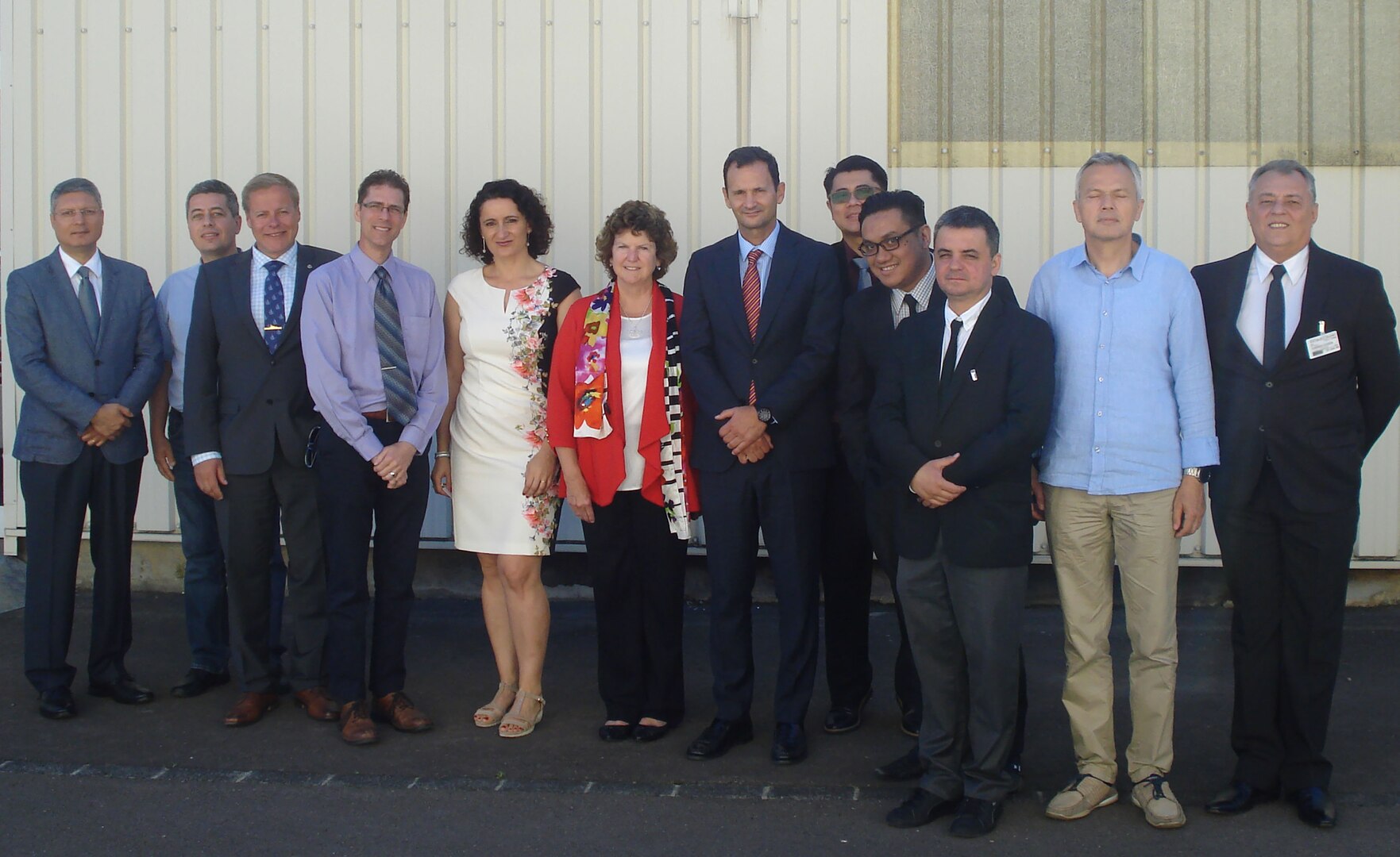 Elaine Chapman (sixth from left), Defense Logistics Agency Logistics Operations employee and new chair of Allied Committee 135’s Main Group, shares a moment with the attendees of the NCB College sessions that opened June 15 in Luxembourg.