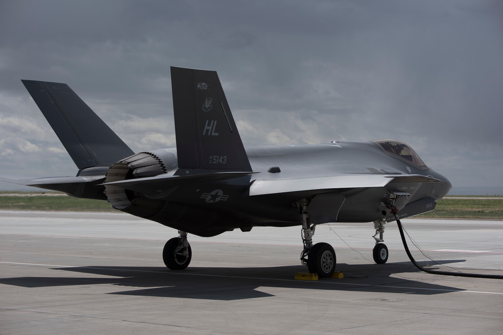 An F-35 Lightning II from Hill Air Force Base, Utah, refuels with a hose cart from the 1970s in a hot-pit on June 20, 2019, at Mountain Home Air Force Base, Idaho. A hot-pit allows aircraft to refuel without turning the engine off and quickly return to the air. The traditional refueling process can take more than an hour before the aircraft can take off, while a hot-pit takes 13 minutes. (U.S. Air Force photo by Airman First Class Andrew Kobialka)