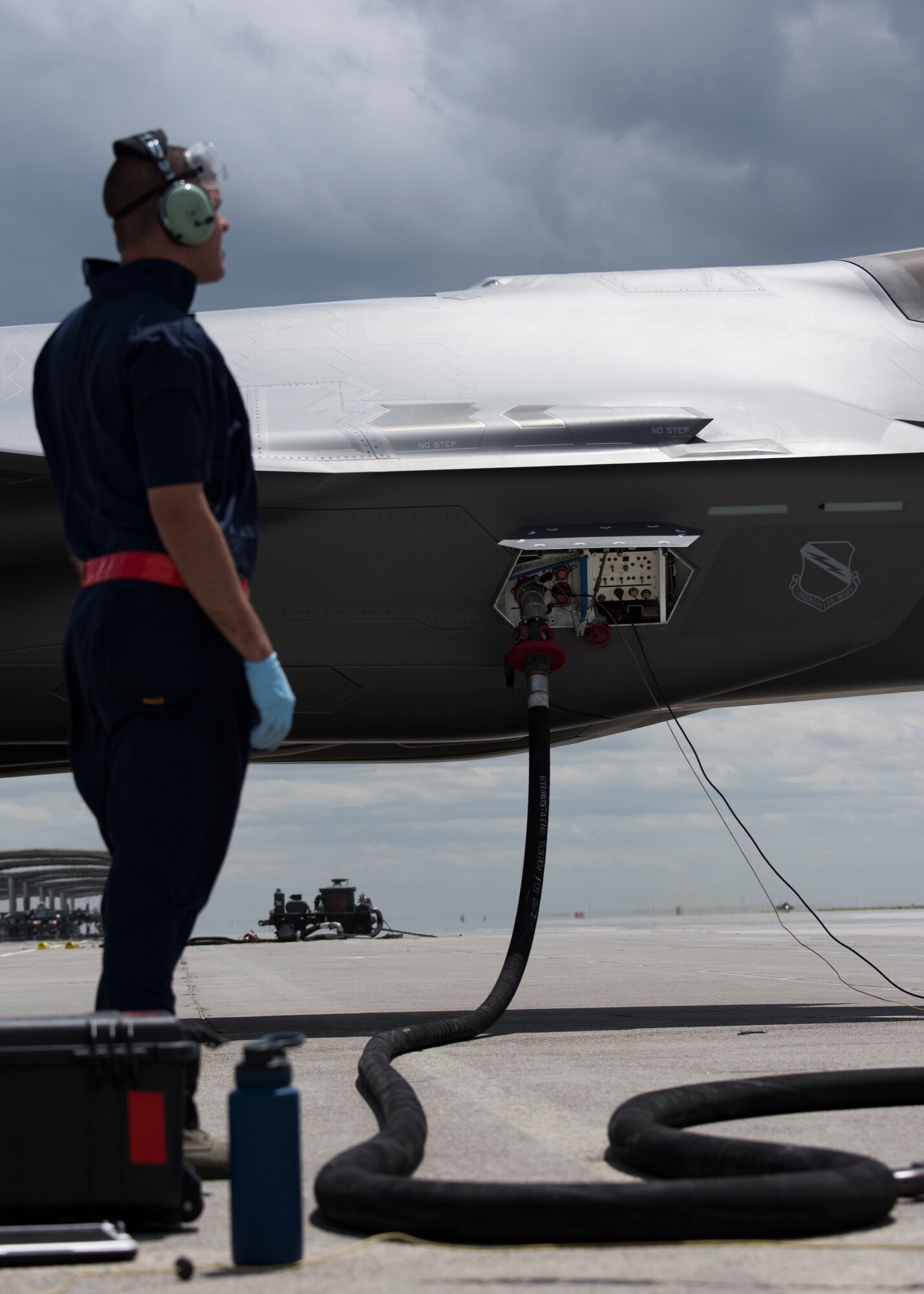 U.S. Air Force Senior Airman Michael Rogers, 388th Aircraft Maintenance Squadron avionics technician, performs a hot-pits refueling with a hose cart from the 1970s on an F-35 Lightning II from Hill Air Force Base, Utah, June 20, 2019, at Mountain Home Air Force Base, Idaho. A hot-pit allows aircraft to refuel without turning the engine off and quickly return to the air. The traditional refueling process can take more than an hour before the aircraft can take off, while a hot-pit takes 13 minutes. (U.S. Air Force photo by Airman First Class Andrew Kobialka)