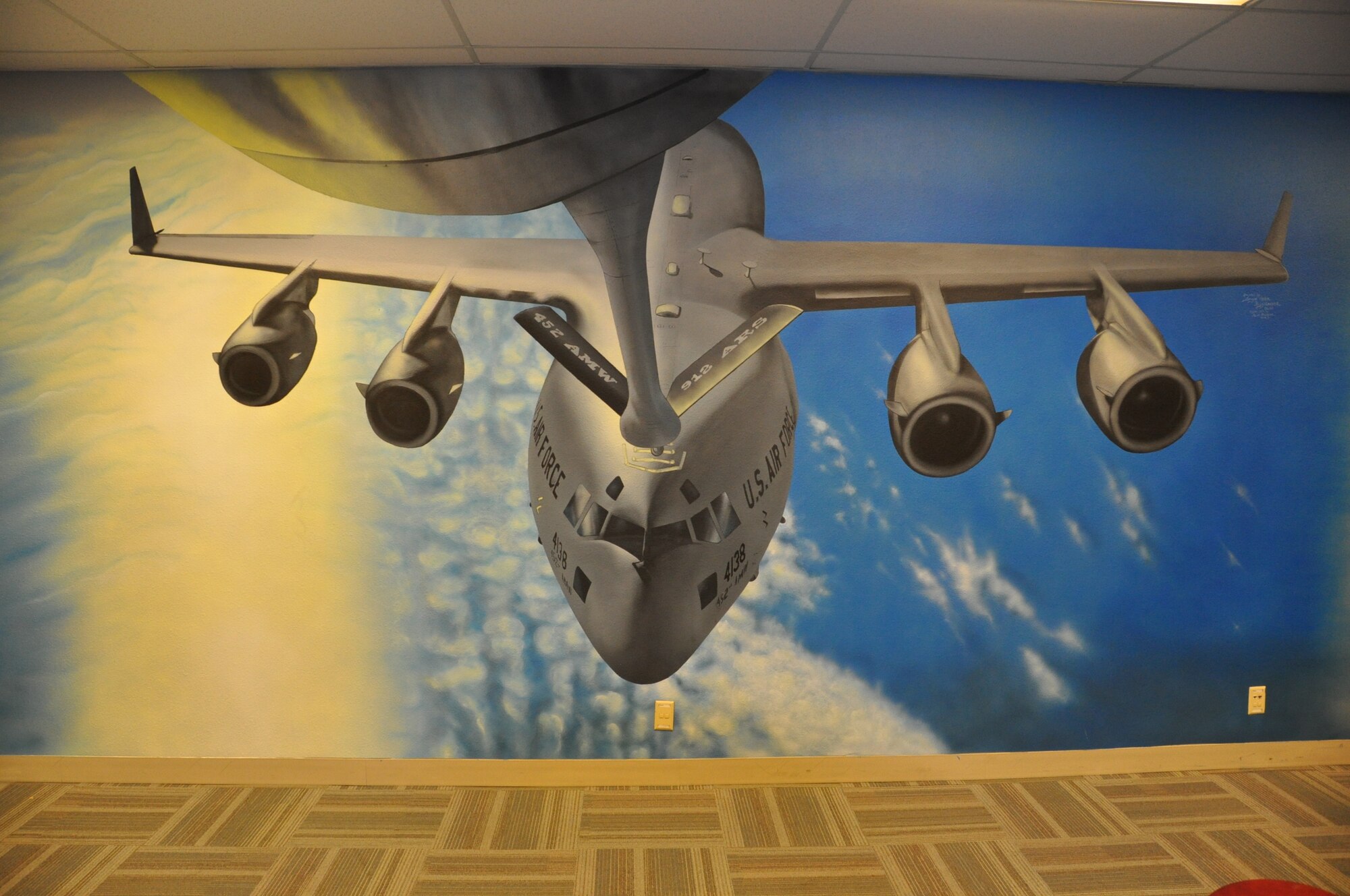 March Field’s 729th Airlift Squadron has C-17 pilots, loadmasters and now at least one honorary 'wallmaster.' Retired Master Sgt. Shayne Meder has officially outdone herself by completing a 9-by-18-foot mural which beautifully depicts an aerial refueling between a 452nd Air Mobility Wing C-17 and KC-135.