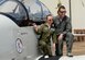 Aubrey Armstrong, the Pilot for a Day, and Capt. Joshua James, a 41st Flying Training Squadron T-6 Texan II instructor pilot, kneel on the wing of a T-6 Texan II June 25, 2019, on Columbus Air Force Base, Miss. Aubrey’s name was put on the side of the T-6. (U.S. Air Force photo by Airman Davis Donaldson)