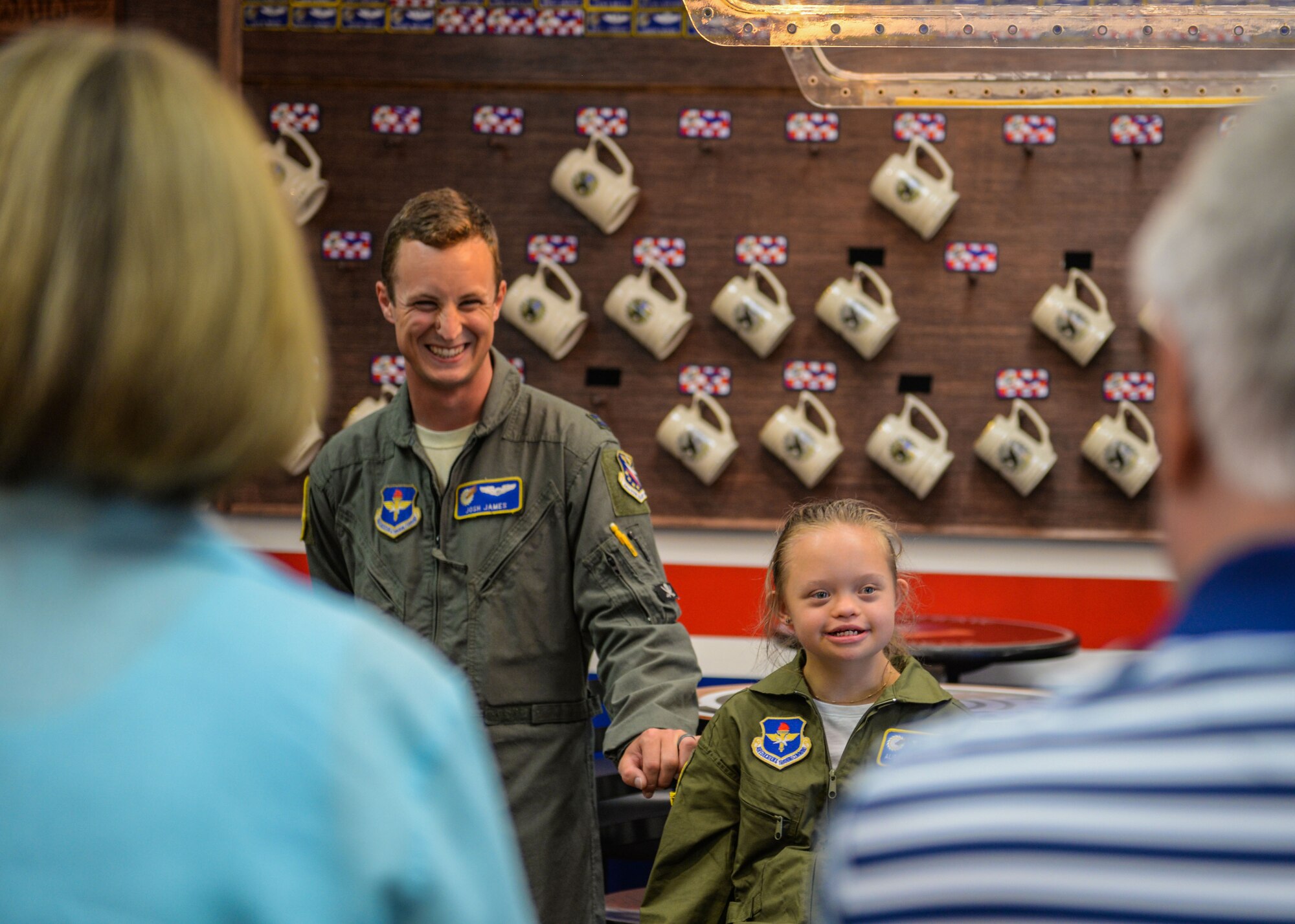 Capt. Joshua James, a 41st Flying Training Squadron T-6 instructor pilot, and Aubrey Armstrong enjoy their time in the 41st FTS June 25, 2019, at Columbus Air Force Base, Miss., during Aubrey’s Pilot for a Day. Aubrey ate lunch with members from the 41st FTS, telling them all the places they had been that day. (U.S. Air Force photo by Airman Davis Donaldson)