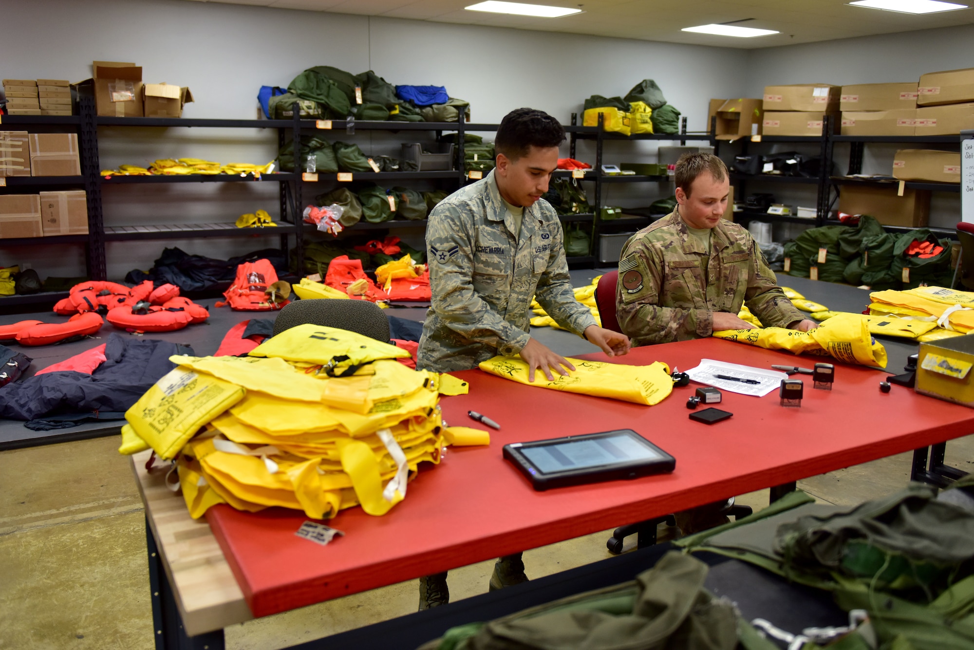 Two Airmen check floats.