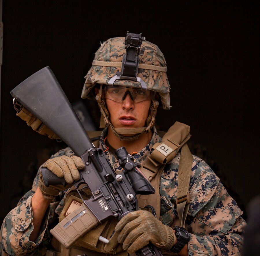 U.S. Marine Corps Cpl. Francisco Villanueva Jr., a military policeman with Alpha Company, 1st Law Enforcement Battalion, I Marine Expeditionary Force Information Group, exits a house during dismounted patrols and detainee operations at De Luz Combat Town at Camp Pendleton, Calif., June 5, 2019. Company A participated in detainee operations and patrolling to prepare its Marines with the knowledge required to operate in a deployed environment. (U.S. Marine Corps photo by Cpl. Rachel R. Mendieta)