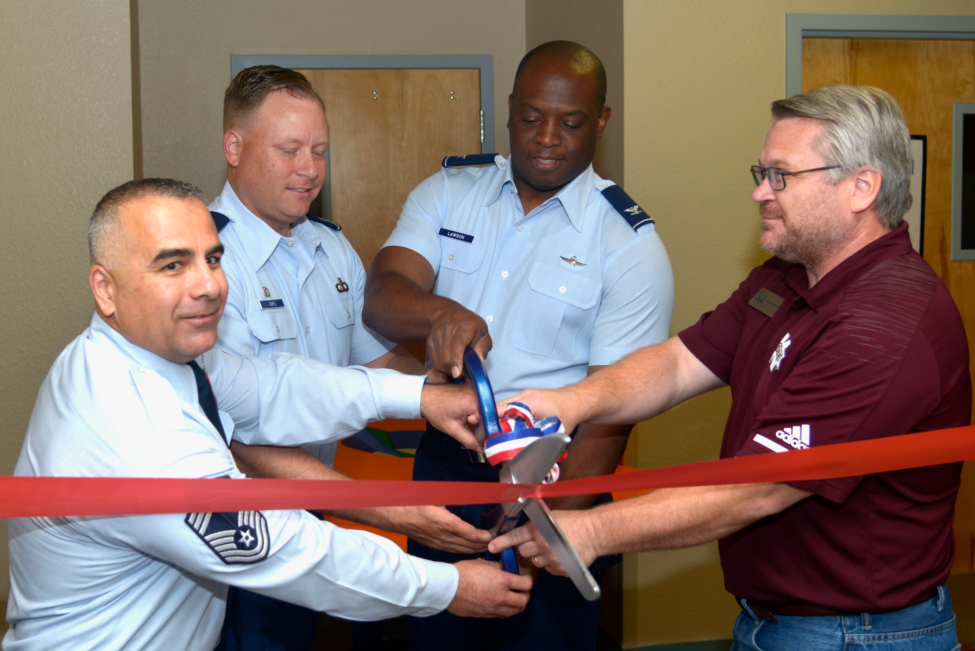 U.S. Air Force Col. Leo Lawson Jr., previous 81st Training Group commander, cuts a ribbon with 334th Training Squadron leadership at Cody Hall, on Keesler Air Force Base, Mississippi, June 28, 2019. The 334th TRS incorporated a VR classroom for a more efficient and visual way of teaching Airfield Maintenance. (U.S. Air Force photo by Airman Seth Haddix)